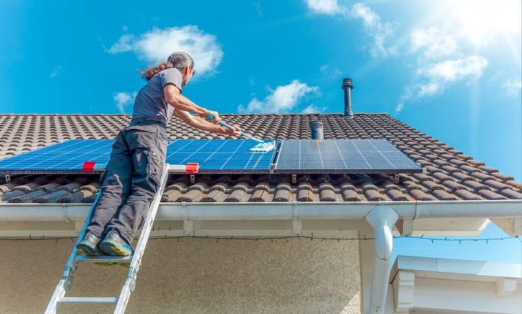 Solar panel cleaning on a residential roof